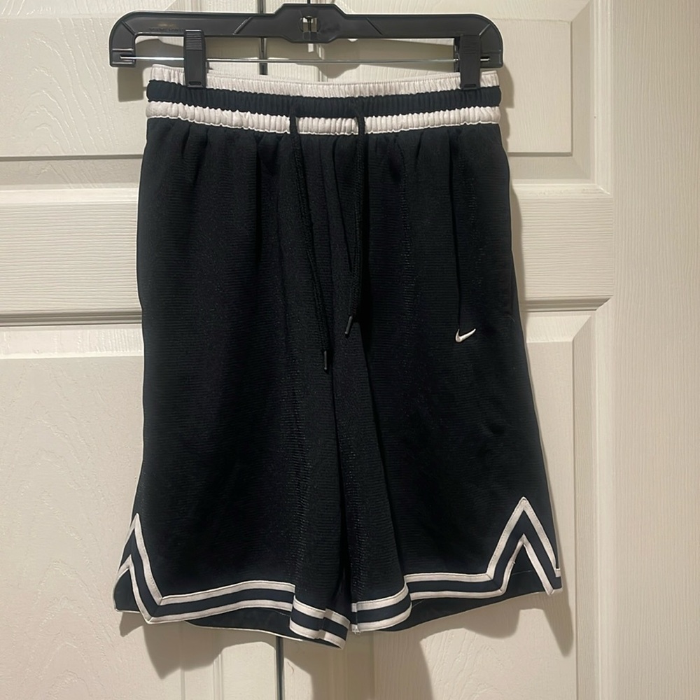 Men’s Nike, basketball shorts, size small, excellent condition.